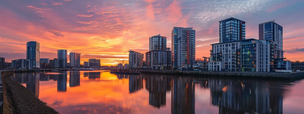 a futuristic urban skyline in cardiff showcases sleek, modern residential buildings under a vibrant sunset, highlighting innovative architectural designs that reflect sustainable living and the city's evolving landscape.
